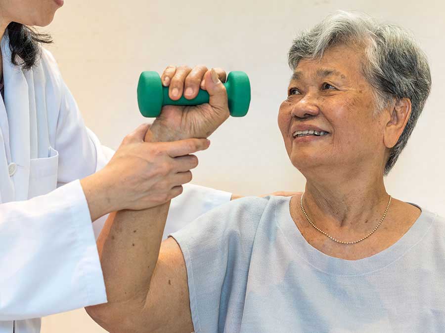 Asian woman with dumbbell