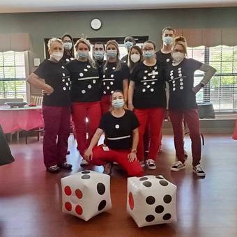 Group with Domino shirts and dice